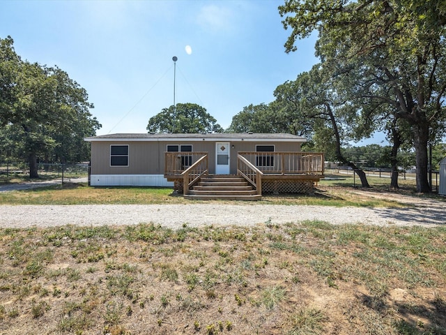 manufactured / mobile home with a wooden deck