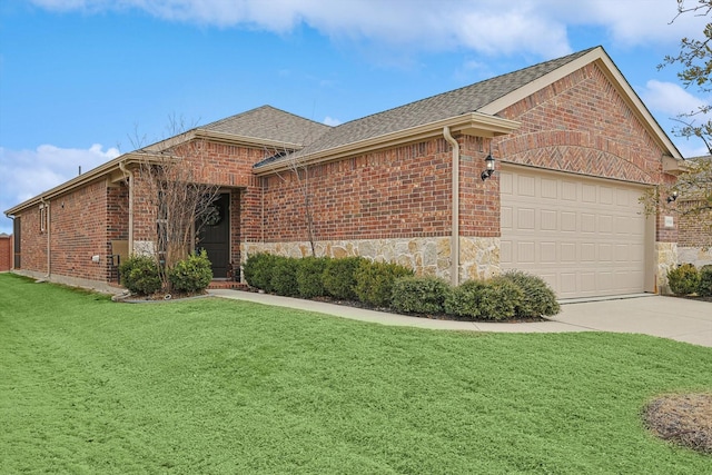 ranch-style home featuring a front lawn and a garage