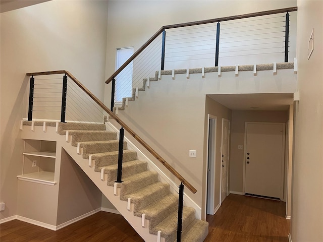 stairway featuring hardwood / wood-style flooring