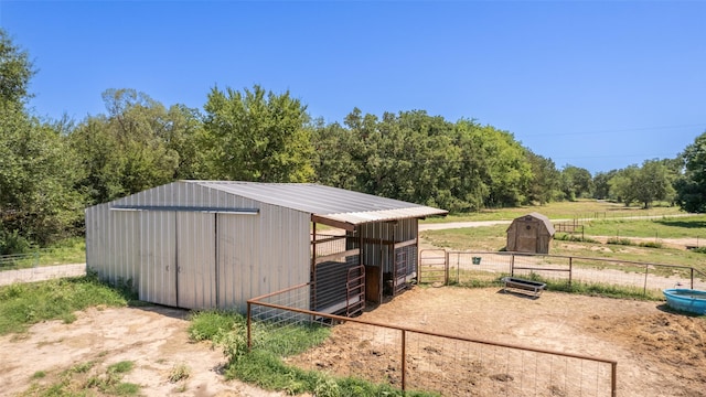 view of outdoor structure with a rural view