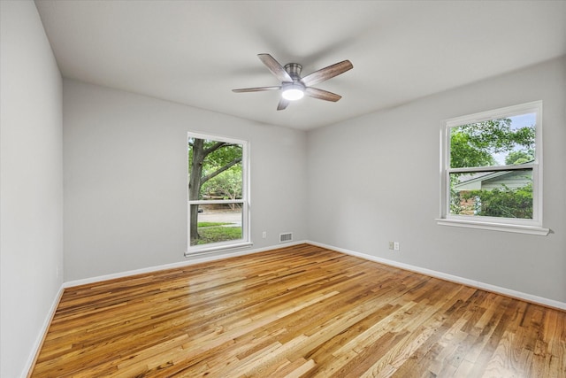 spare room featuring ceiling fan and light wood-type flooring