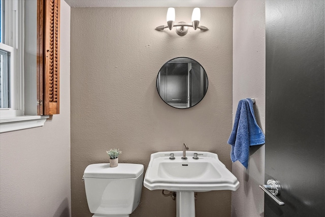 bathroom with sink and toilet