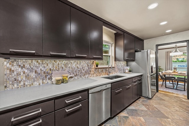 kitchen featuring decorative backsplash, sink, dark brown cabinetry, and appliances with stainless steel finishes