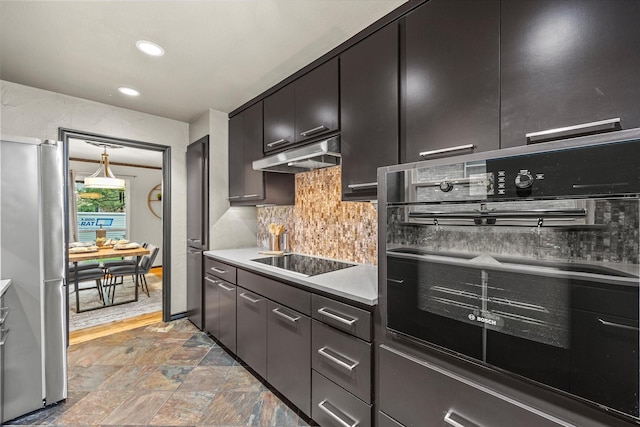 kitchen featuring tasteful backsplash and black appliances