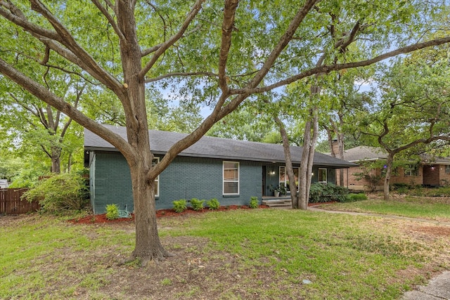 single story home featuring a front yard