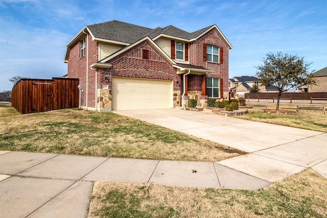 view of front of property with a garage and a front yard