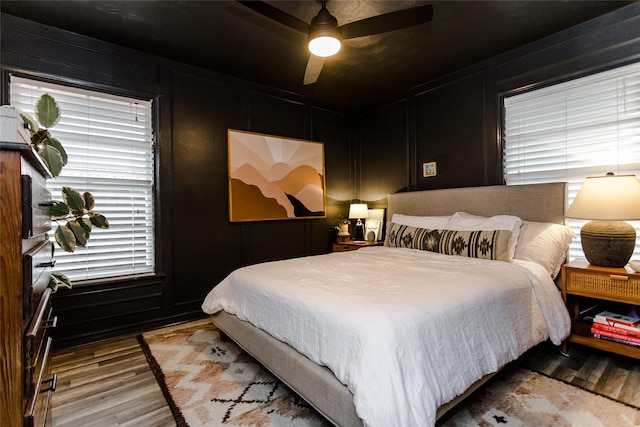 bedroom featuring light wood-type flooring and ceiling fan