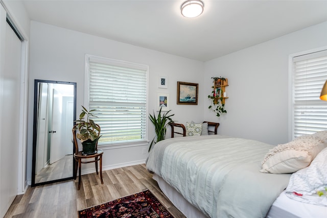 bedroom with light wood-type flooring