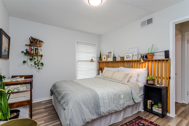 bedroom featuring wood-type flooring