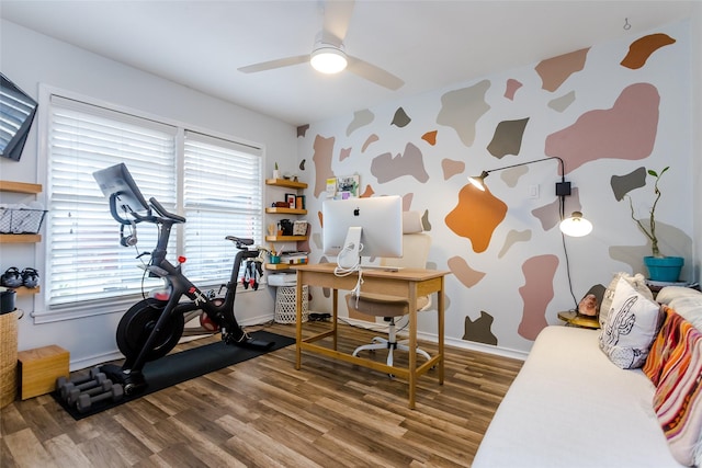 interior space with ceiling fan, wood-type flooring, and plenty of natural light