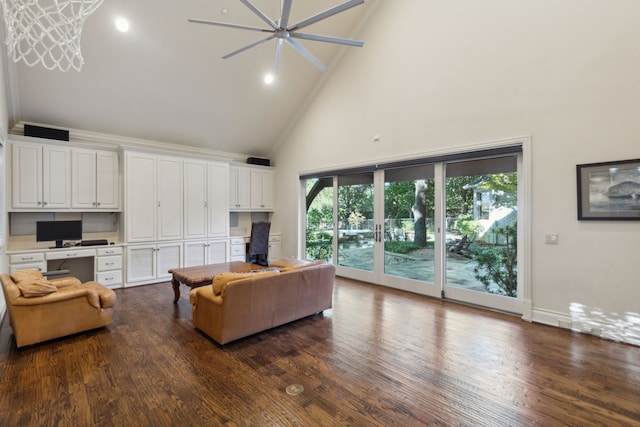 living room featuring built in desk, dark hardwood / wood-style flooring, and high vaulted ceiling