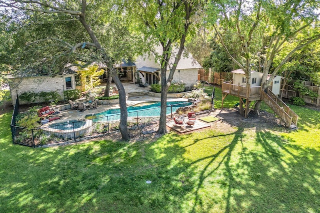 view of swimming pool featuring a patio area and a yard