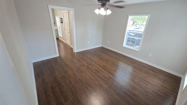 unfurnished room with ceiling fan and dark hardwood / wood-style floors