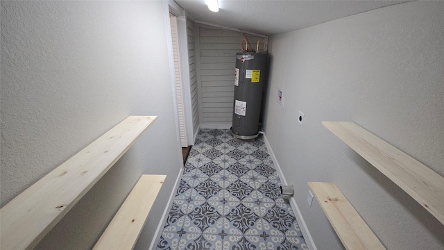 utility room with electric water heater