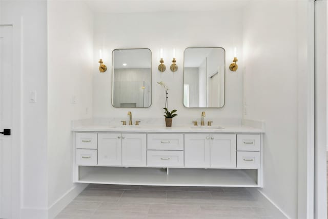 bathroom featuring tile patterned floors and vanity