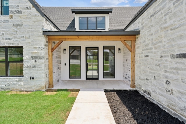 view of exterior entry featuring a patio area