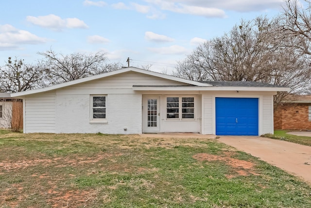 ranch-style house with a garage and a front yard