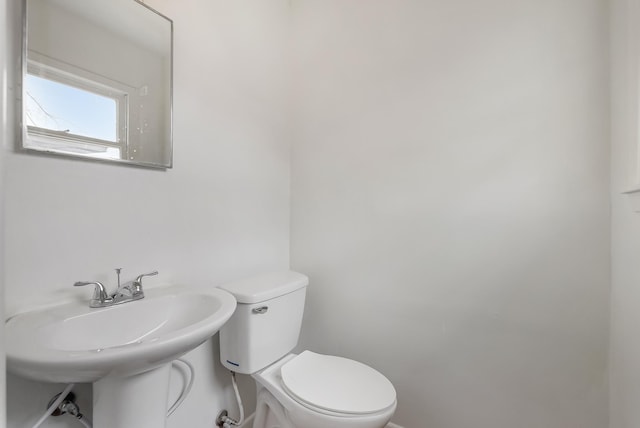 bathroom with sink and toilet