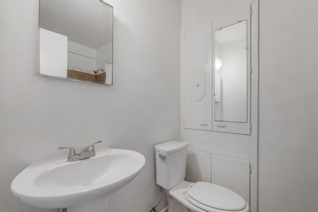 bathroom with sink and toilet