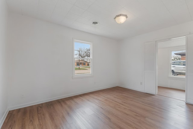 empty room featuring hardwood / wood-style flooring