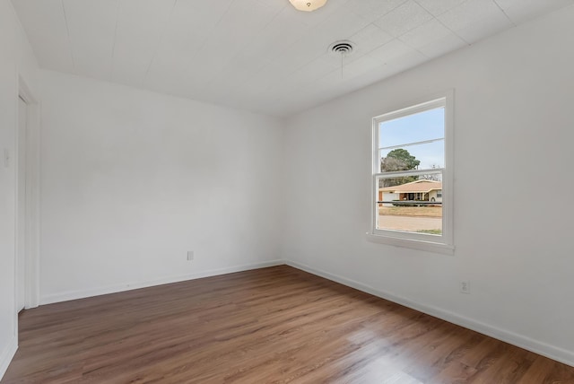 empty room with wood-type flooring