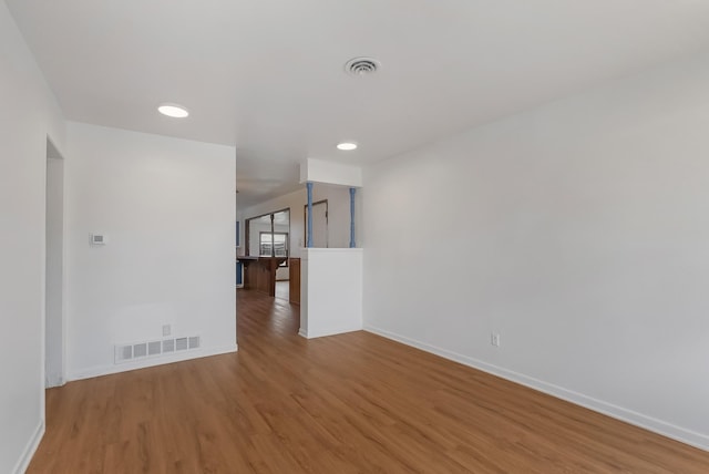 spare room featuring light wood-type flooring