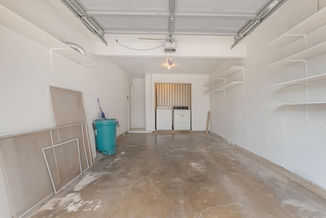 garage featuring a garage door opener and washing machine and clothes dryer