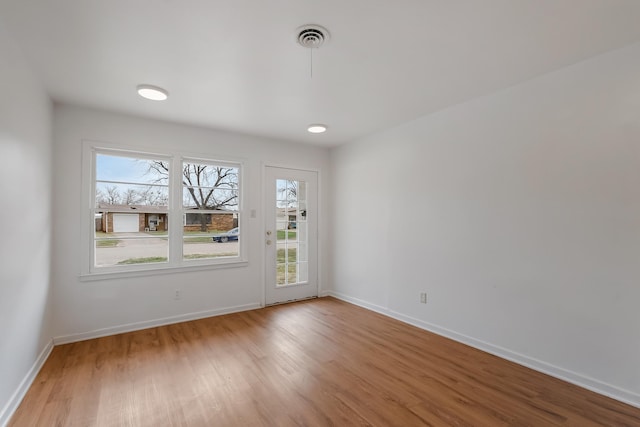 spare room featuring hardwood / wood-style flooring