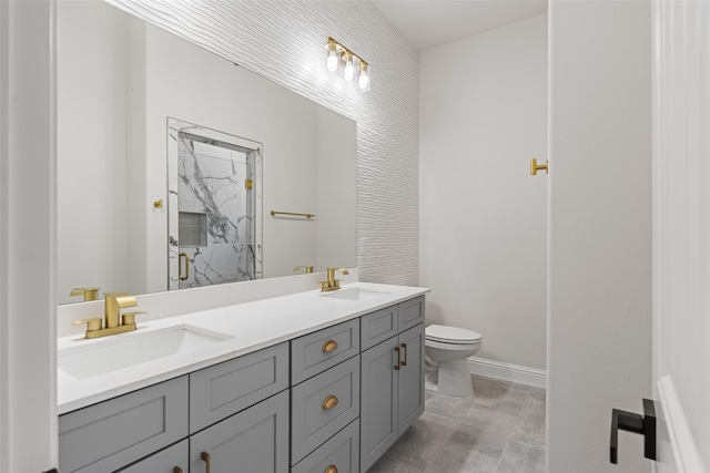 bathroom featuring an enclosed shower, vanity, and toilet