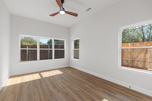 spare room featuring ceiling fan and wood-type flooring