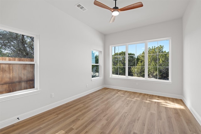 empty room featuring ceiling fan and light hardwood / wood-style floors