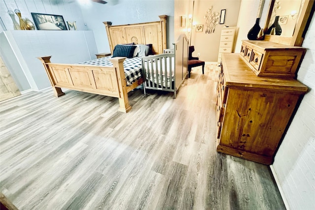 bedroom with light wood-type flooring