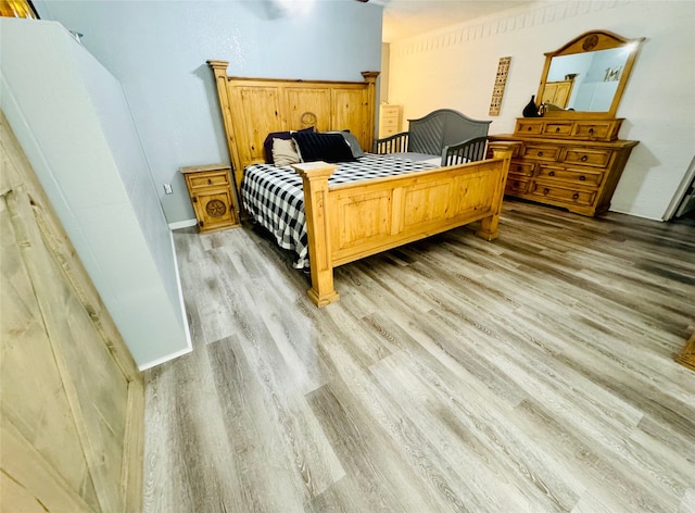 bedroom with light hardwood / wood-style flooring