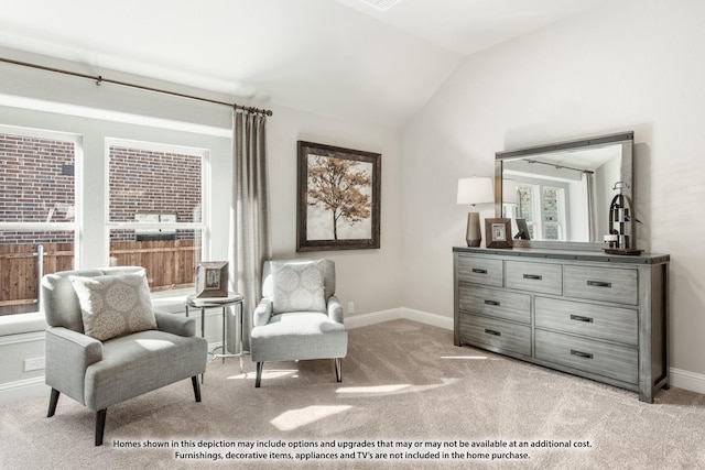 living area with vaulted ceiling and light colored carpet