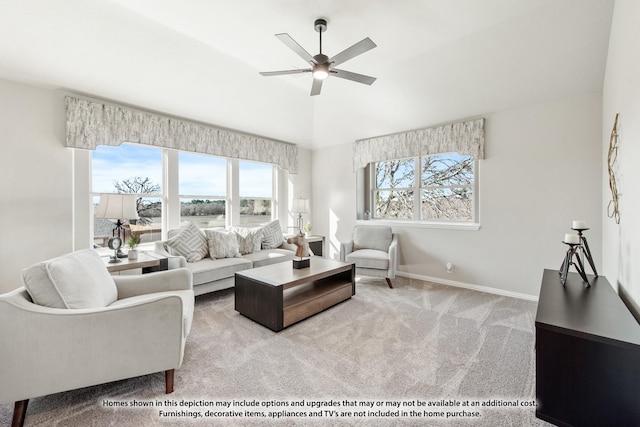 carpeted living room with ceiling fan