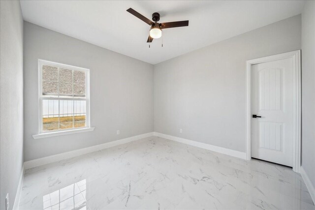 spare room featuring ceiling fan