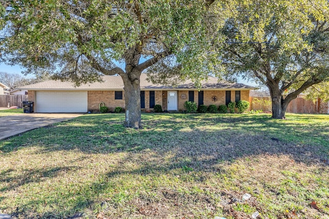 ranch-style house with a garage and a front lawn