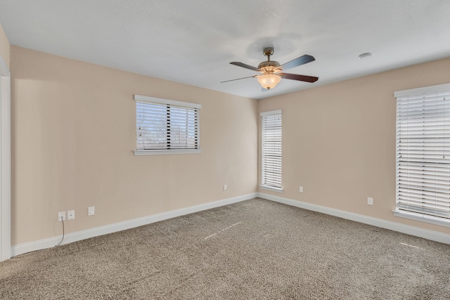 spare room with ceiling fan and carpet floors