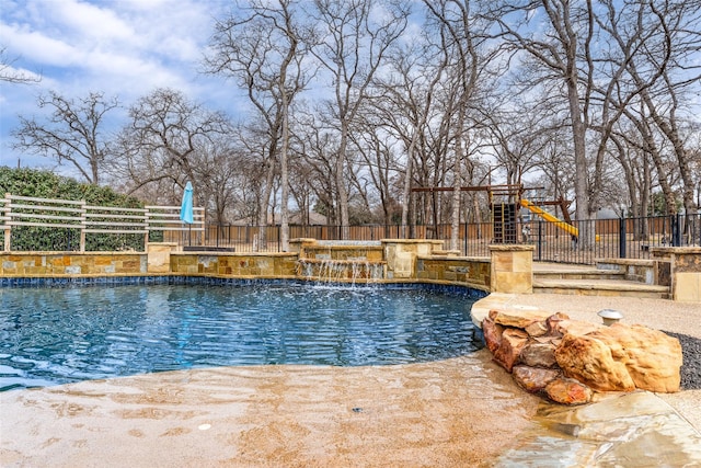 view of pool with pool water feature