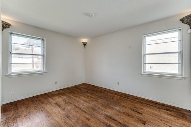 empty room featuring dark hardwood / wood-style floors