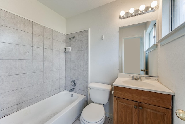 full bathroom with toilet, tiled shower / bath combo, and vanity