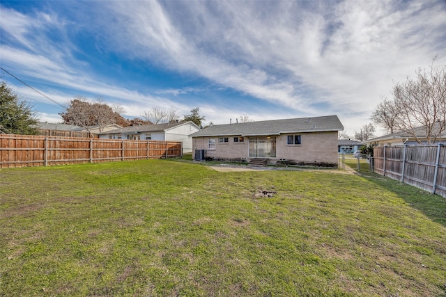 back of property featuring a patio area, a yard, and central AC unit