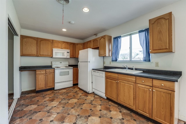 kitchen with sink and white appliances