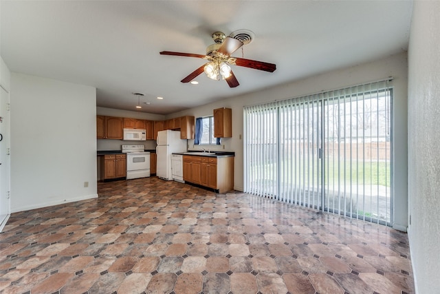 kitchen with ceiling fan, sink, and white appliances