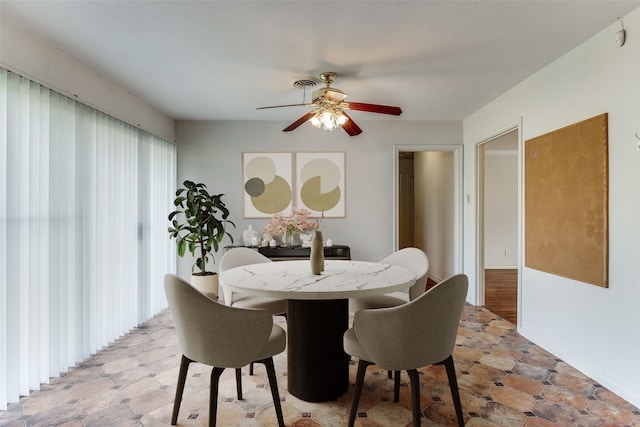 dining space with ceiling fan