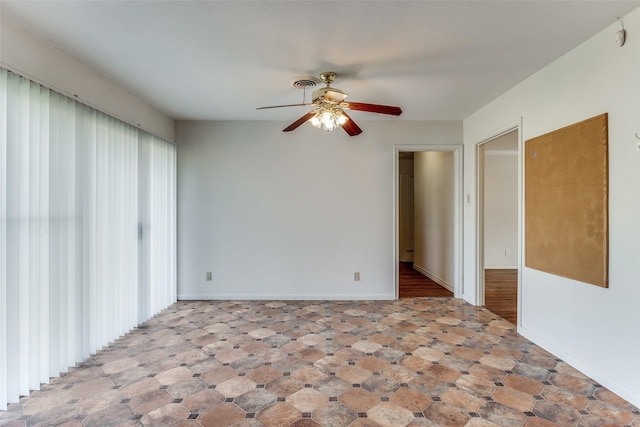 unfurnished room with ceiling fan