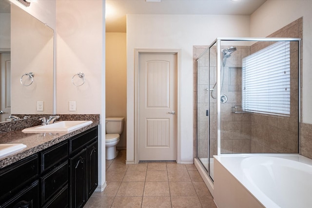 full bathroom with toilet, shower with separate bathtub, vanity, and tile patterned flooring