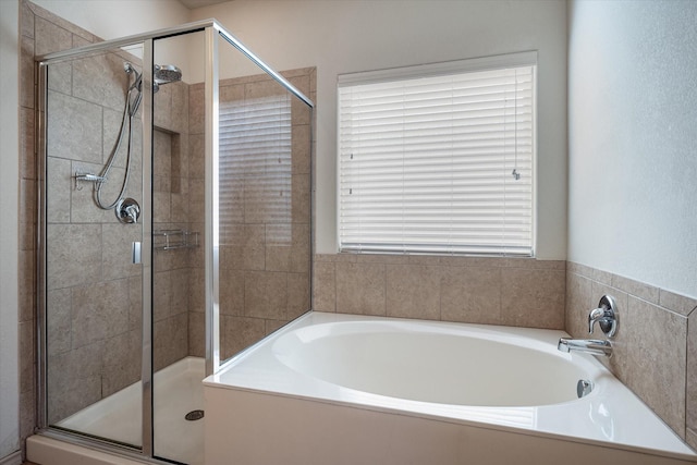 bathroom with shower with separate bathtub