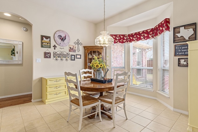 dining area featuring light tile patterned flooring