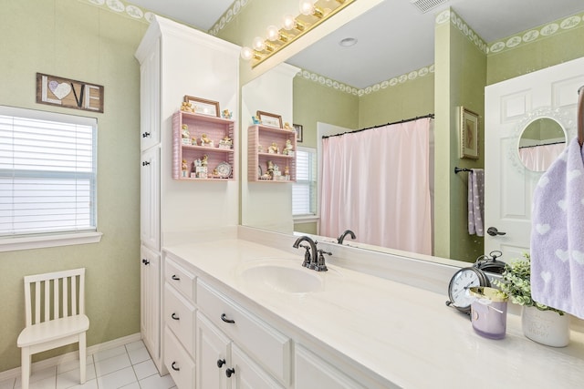 bathroom featuring tile patterned floors and vanity